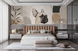 A cozy bedroom featuring the French Bulldog mural as a modern backdrop behind a cream-colored sofa.