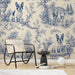 A charming guest bedroom with French Bulldog patterned walls and traditional cream furniture.
