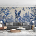 A stylish home office with a classic blue and white floral mural and traditional furniture.