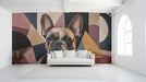 A modern living room featuring the geometric French bulldog wall mural behind a charcoal sofa.