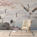 A home study with a traditional landscape mural featuring cranes and spring flowers.
