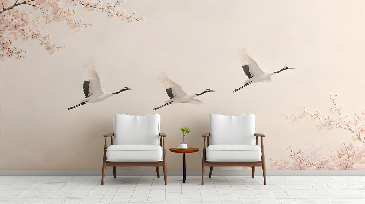 Entryway interior with a serene crane and cherry blossom mural behind a beige linen sofa