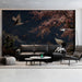 Quiet living room corner with an intricate dark landscape mural and wooden accents.