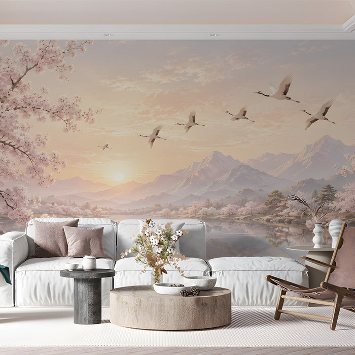 A serene living room space decorated with a calming landscape wallpaper of a mountain sunrise and cranes.