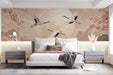 An elegant bedroom scene with a crane and cherry blossom mural as a backdrop for a modern minimalist table setting.