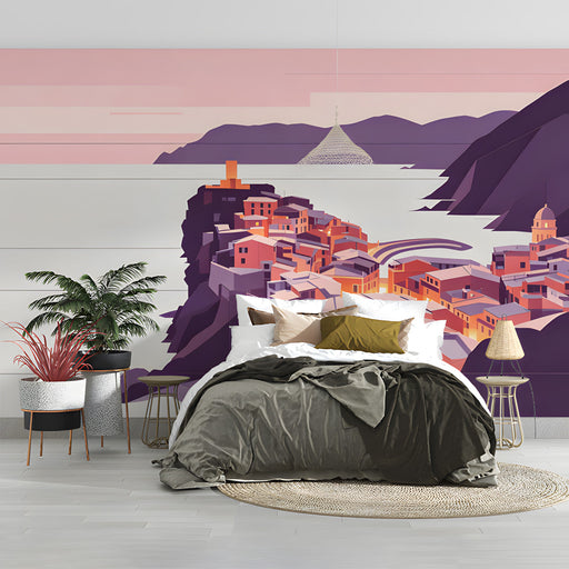 A coastal village mural installed on a feature wall in a sunlit bedroom with minimalist decor.