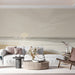 Calming sunset wall mural behind a minimalist wooden bed frame in a living room