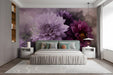 A romantic bedroom featuring a large-scale purple dahlia floral mural behind a tufted velvet headboard.