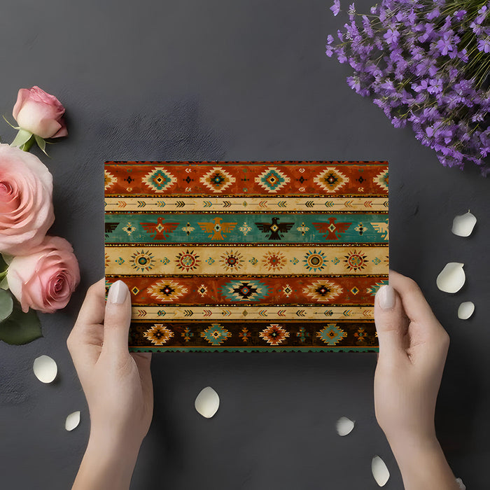 A home office workspace with the tribal pattern wallpaper creating a textured backdrop for a solid wood desk.