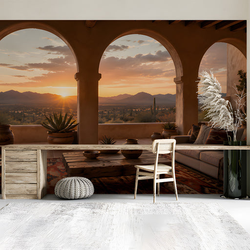 A cozy study room featuring the desert sunset arch wallpaper on the main wall behind a leather sofa