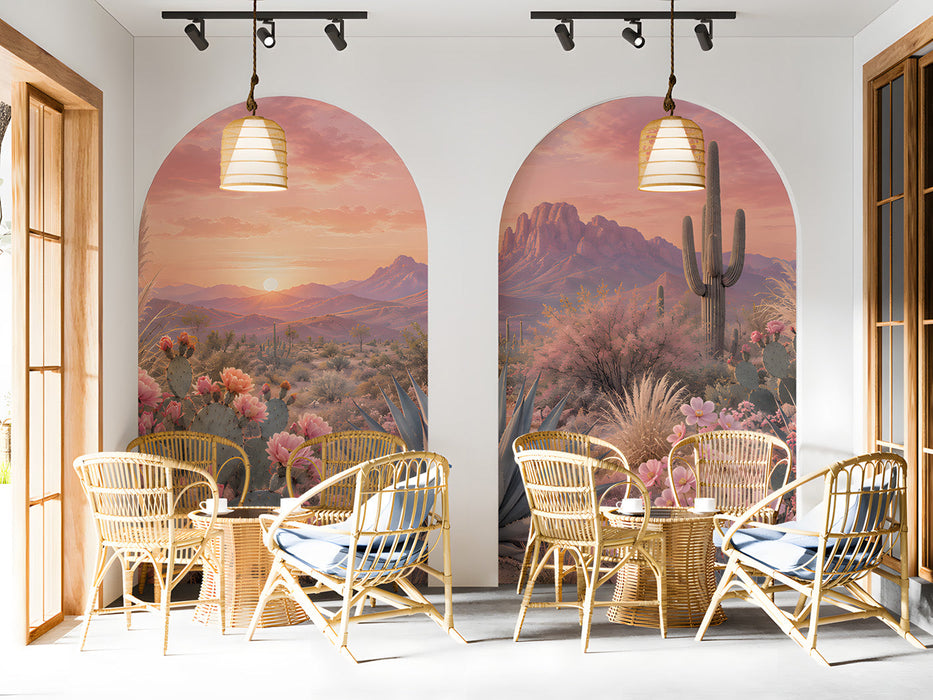 A cozy bar wall featuring a soft pink desert sunset landscape mural behind a simple headboard.