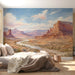 Bedroom space with an expansive desert canyon mural providing a calm, scenic backdrop