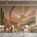 Modern cafe featuring a serene desert sunrise mural above a low-profile platform bed