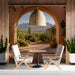 A restaurant space featuring the desert archway wallpaper as a panoramic feature wall.