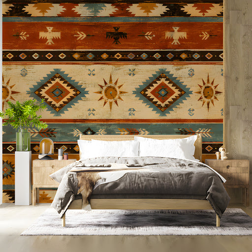 Bedroom featuring southwestern geometric wallpaper behind a leather sofa