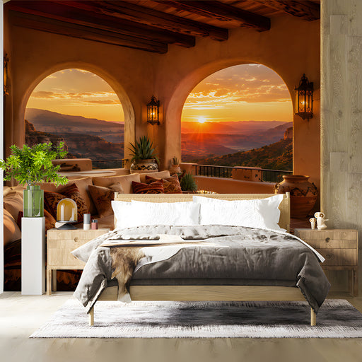 A desert canyon mural covering a bedroom wall with terracotta decor and natural sunlight.