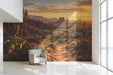 A cozy study featuring the desert sunset wallpaper mural behind a low-profile sofa with leather accents.