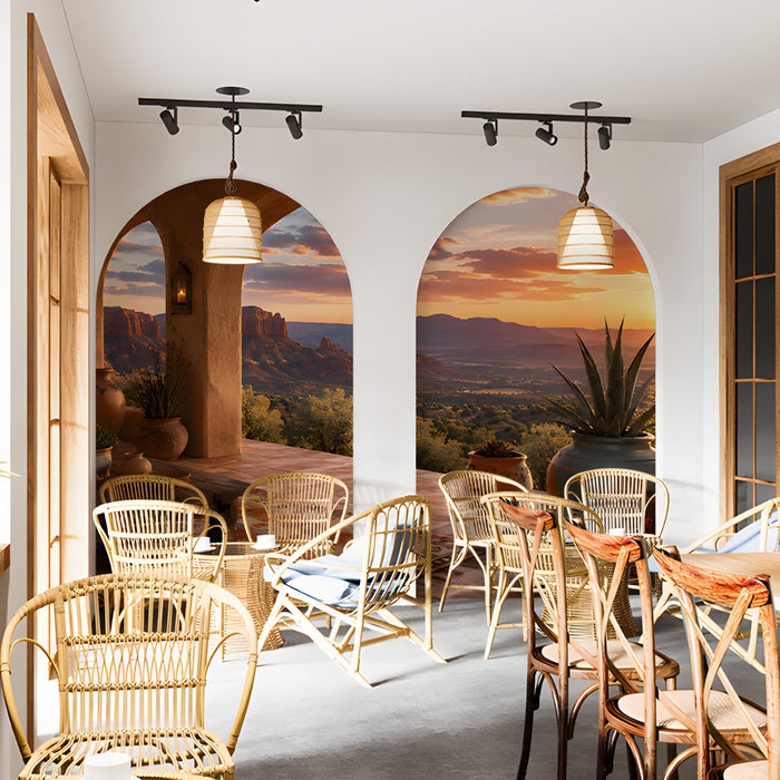 A cozy bar featuring the desert sunset wallpaper mural, paired with a terracotta rug and wooden furniture.