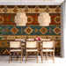 A dining room wall decorated with a vibrant Southwestern textile-inspired geometric wallpaper.