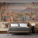 A bedroom space decorated with a desert horizon wallpaper mural, creating a relaxing and creative work environment.