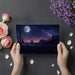 Starlit desert wall mural covering a large living room wall behind a mid-century sofa