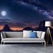 Home cinema wall showing a vast desert night sky mural, creating a deep and inspiring backdrop for a workspace.