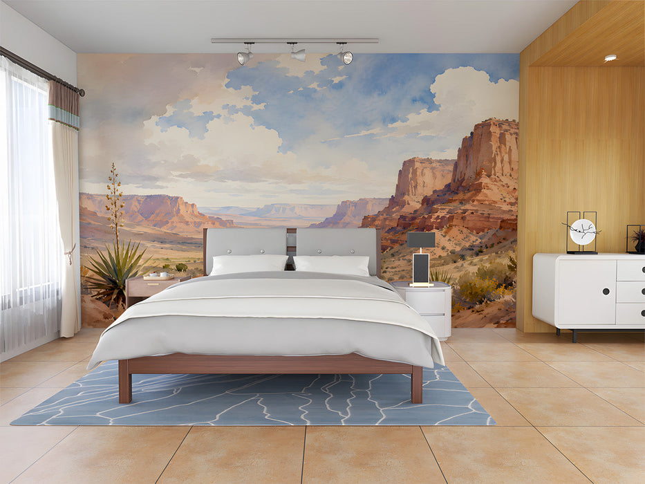 A cozy bedroom featuring the desert canyon mural on a large feature wall behind a linen sofa.