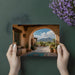 A bright dining area with the desert landscape mural on a focal wall