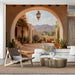 Desert landscape mural in a calm living room featuring warm clay tones and a wide-arched design.