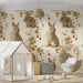 Cozy nursery room with rabbit and strawberry patterned wallpaper behind a wooden crib