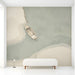 A peaceful entryway featuring a minimalist coastal boat mural on the main accent wall