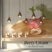 A playful café interior wall mural showcasing a berry cream illustration in a light and airy seating area.