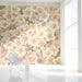 Floral pattern featured in a sun-drenched study with linen