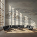 A cozy hallway wall featuring a panoramic watercolor mountain landscape in soft neutrals.