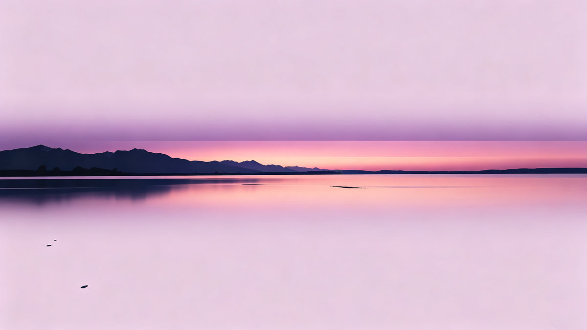 Abstract minimalist sunset wallpaper featuring a smooth gradient from pale lilac to vibrant rose with mountain silhouettes