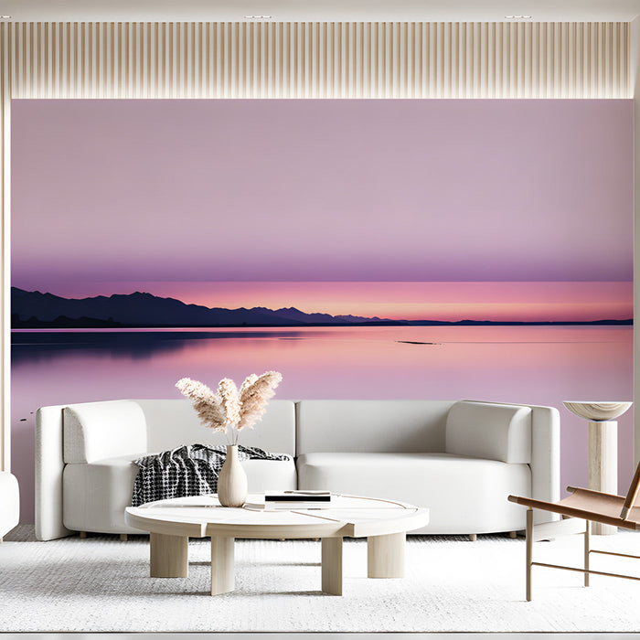 Soft gradient pink wall mural behind a lounge chair in a living room