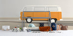 Retro camper van mural styled in a bright child's bedroom with wooden furniture