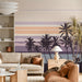 Modern living room with a calm, graphic palm beach landscape mural on the primary wall.