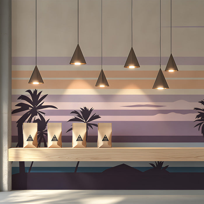 Coastal style shop with a sunset palm beach wall mural and light wooden furniture.
