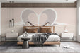 Minimalist heart mural wallpaper installed in a bright modern bedroom above a bed