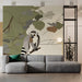 A cozy commercial space corner featuring modern lemur wall decor and a linen armchair