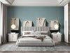 Modern bedroom featuring typography mural wallpaper behind a bed