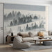A cozy living room wall decorated with a soft grey and cream pine forest landscape wallpaper.