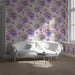 A bright entryway with a fuchsia floral mural on the wall, styled with white crib and light wooden furniture