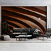Living room wall featuring rhythmic terracotta curves for a grounded, focused workspace.