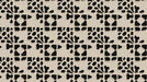 Geometric wallpaper pattern with charcoal organic shapes and stepped blocks on a neutral warm beige background.