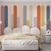 Contemporary bedroom with playful abstract dripping paint lines as a background wall feature