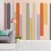 Modern home office with abstract dripping line wallpaper on the back wall behind a wooden desk
