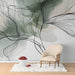 Elegant home office space with botanical watercolor wallpaper and a mid-century modern desk.