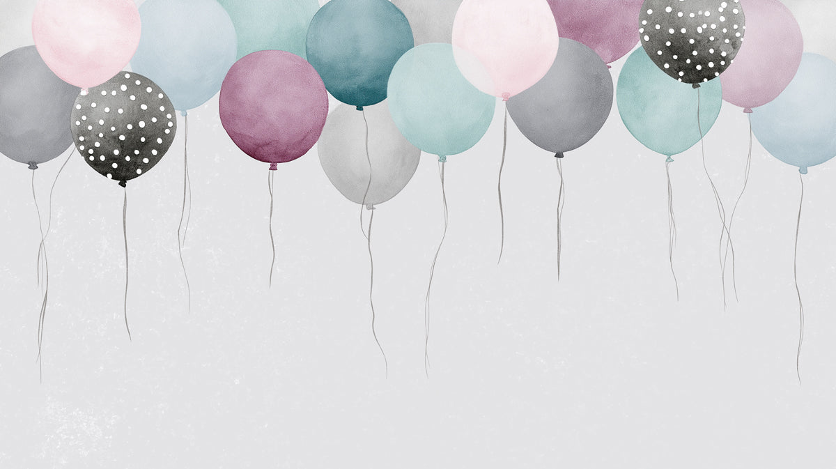 Watercolor mural wallpaper featuring floating balloons in blush, mint, and blue with charcoal spotted accents